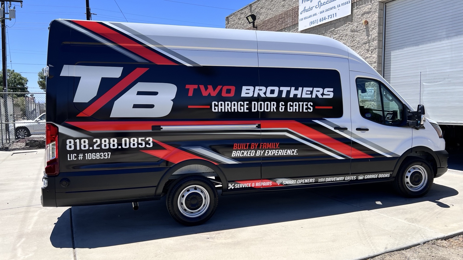 Two Brothers Garage Door & Gates service van with the red, white and black T/B logo